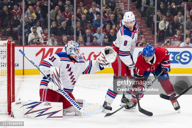 Igor Shesterkin of the New York Rangers makes a glove save during the second period of the NHL regular season game between the Montreal Canadiens and...