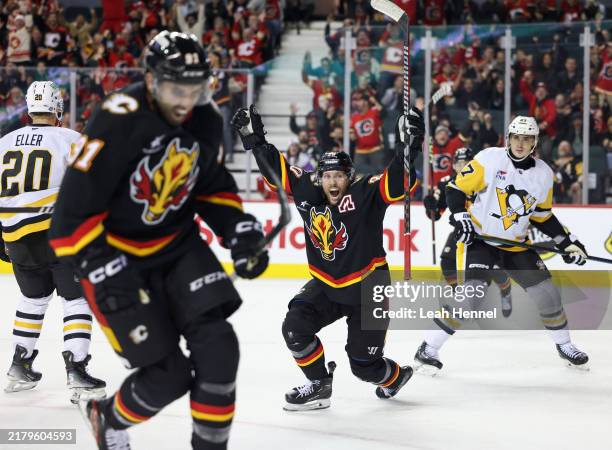 Blake Coleman of the Calgary Flames celebrates his assist on the tying goal by Nazem Kadri to send the game into overtime against the Pittsburgh...