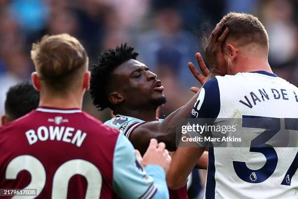 Mohammed Kudus of West Ham United clashes with Micky van de Ven of Tottenham Hotspur and is subsequently shown a Red card during the Premier League...