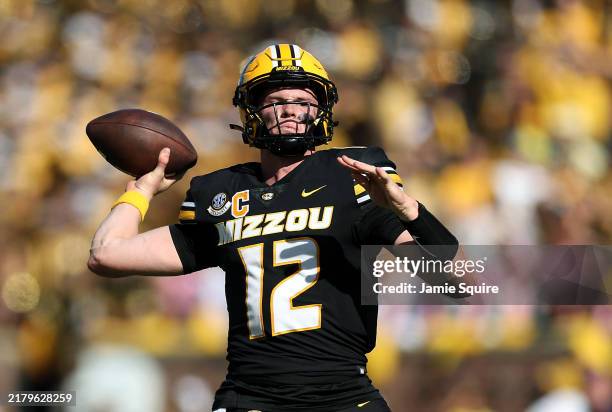 Quarterback Brady Cook of the Missouri Tigers passes during the 2nd half of the game against the Auburn Tigers at Faurot Field/Memorial Stadium on...