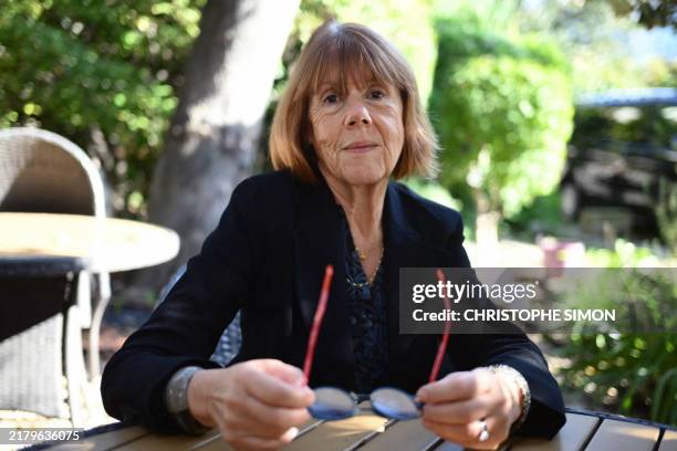 Gisele Pelicot poses in Avignon, on October 23 during the trial of her former partner accused of drugging her for nearly ten years and inviting...