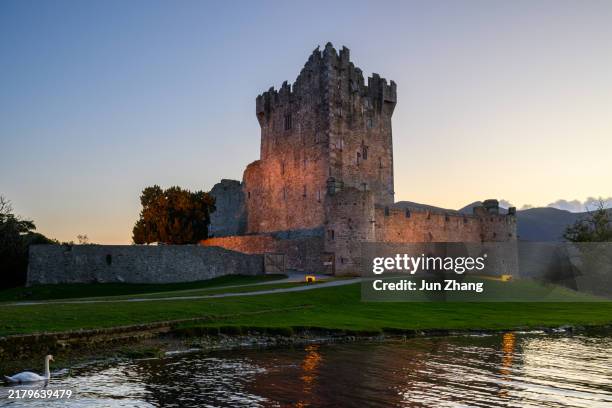 illuminated ross castle in the evening - ireland castle stock pictures, royalty-free photos & images