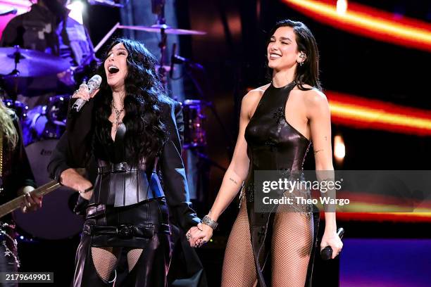 Cher and Dua Lipa perform onstage during the 2024 Rock & Roll Hall Of Fame Induction Ceremony streaming on Disney+ at Rocket Mortgage Fieldhouse on...