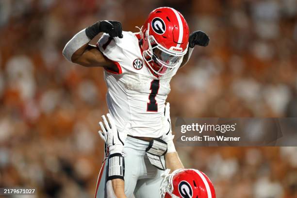 Trevor Etienne of the Georgia Bulldogs celebrates his touchdown with teammates during the second quarter against the Texas Longhorns at Darrell K...