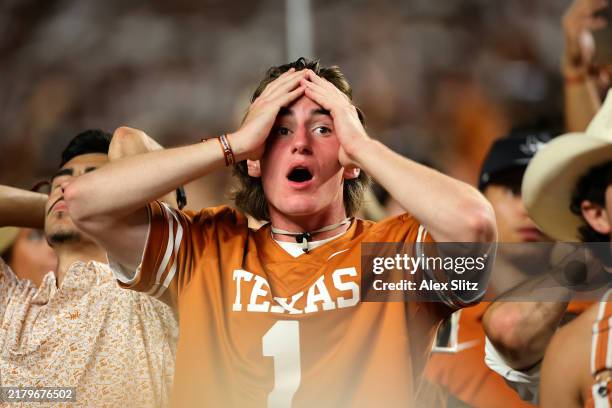 Texas Longhorns fans react after a pass interference call during the third quarter against the Georgia Bulldogs at Darrell K Royal-Texas Memorial...
