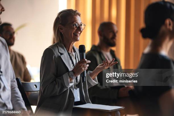 engaged attendees at a professional business conference event - involvement stockfoto's en -beelden