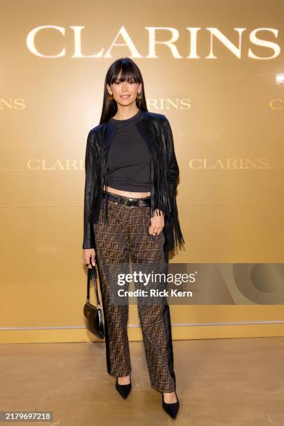 Nina Dobrev attends Clarins Double Serum launch party on October 19, 2024 in Austin, Texas.