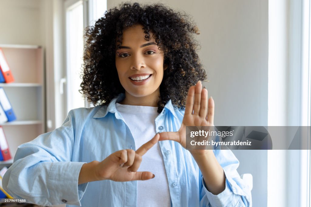Young woman using a sign language