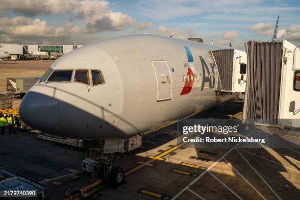 An American Airlines Boeing 777 plane is parked waiting for passengers to board October 18, 2024 at London Heathrow Airport, United Kingdom.