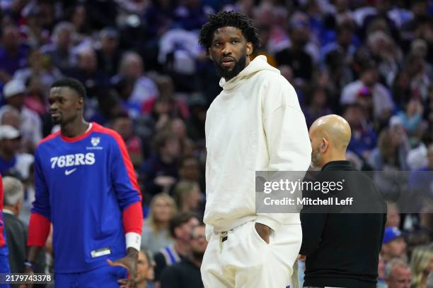 Joel Embiid of the Philadelphia 76ers looks on during a timeout against the Milwaukee Bucks in the first half at the Wells Fargo Center on October...