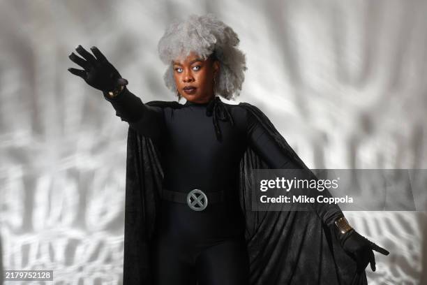 Cosplayer dressed as Storm poses for a photo during 2024 New York Comic Con at Jacob Javitz Center on October 19, 2024 in New York City.