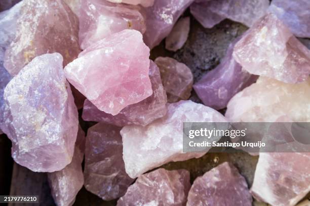close-up of rose quartz crystals - rose quartz stock pictures, royalty-free photos & images