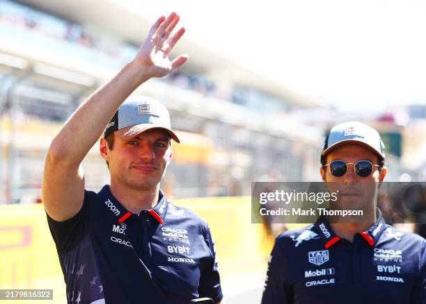 Max Verstappen of the Netherlands and Oracle Red Bull Racing and Sergio Perez of Mexico and Oracle Red Bull Racing look on from the drivers parade...