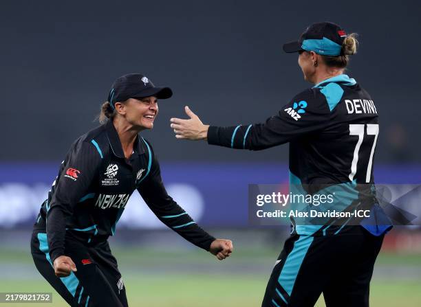 Sophie Devine of New Zealand celebrates with teammate Suzie Bates after defeating South Africa during the ICC Women's T20 World Cup Final 2024 match...