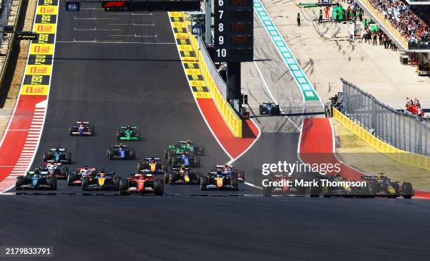 Max Verstappen of the Netherlands driving the Oracle Red Bull Racing RB20 leads Lando Norris of Great Britain driving the McLaren MCL38 Mercedes and...
