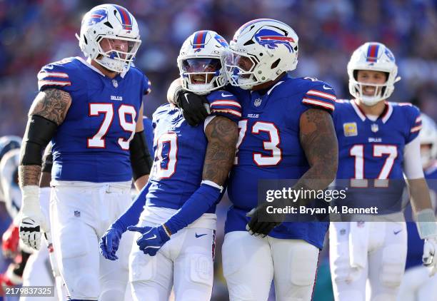 Keon Coleman of the Buffalo Bills celebrates with teammates after gaining yards against the Tennessee Titans during the fourth quarter at Highmark...