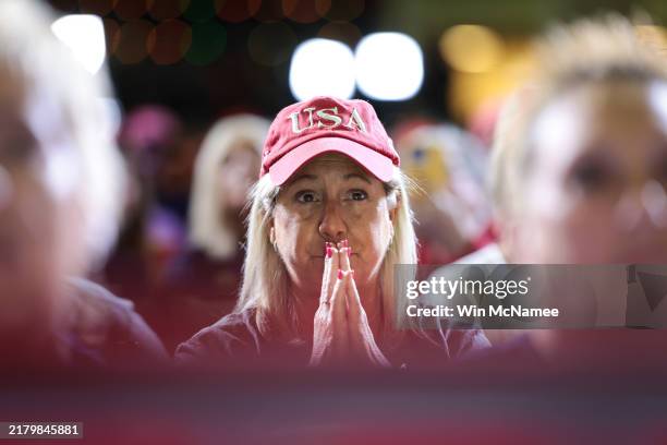 An attendee listens as Republican presidential nominee, former U.S. President Donald Trump, speaks during a town hall campaign event at the Lancaster...