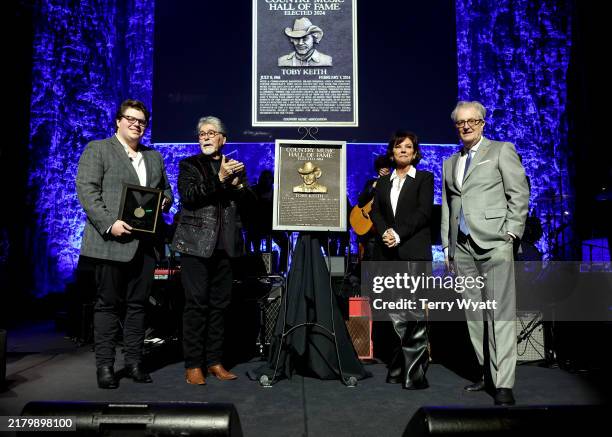 Stelen Keith Covel, Randy Owen, Tricia Covel and CEO of the Country Music Hall of Fame and Museum Kyle Young speak onstage at the Class of 2024...