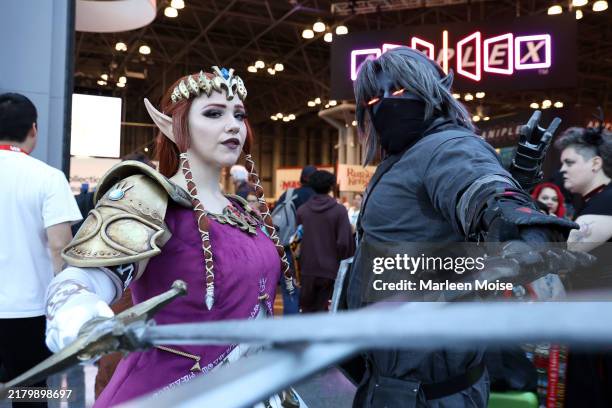 Cosplayers pose during the 2024 New York Comic Con at Jacob Javitz Center on October 20, 2024 in New York City.