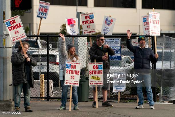 Boeing workers gather on a picket line near the entrance to a Boeing facility during an ongoing strike on October 24, 2024 in Seattle, Washington....