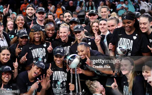 The New York Liberty pose after the win over Minnesota Lynx in Game Five of the WNBA Finals at Barclays Center on October 20, 2024 in the Brooklyn...