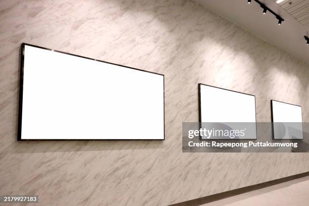 three blank billboard poster in the subway station - subway platform poster stock pictures, royalty-free photos & images