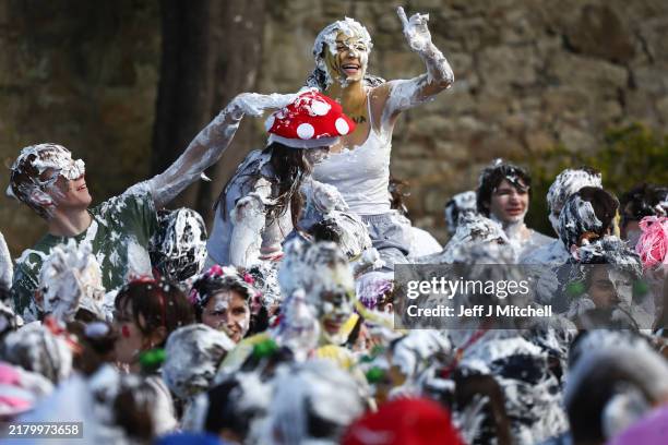 First year students take part in the annual St Andrews Raisin day Foam fight on October 21, 2024 in St Andrews, Scotland. The Raisin Monday foam...