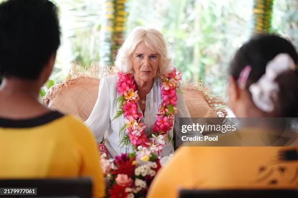 Queen Camilla meets a group of young people supported by the Samoa Victim Support Group during her visit to the Samoa Victim Support Group on October...