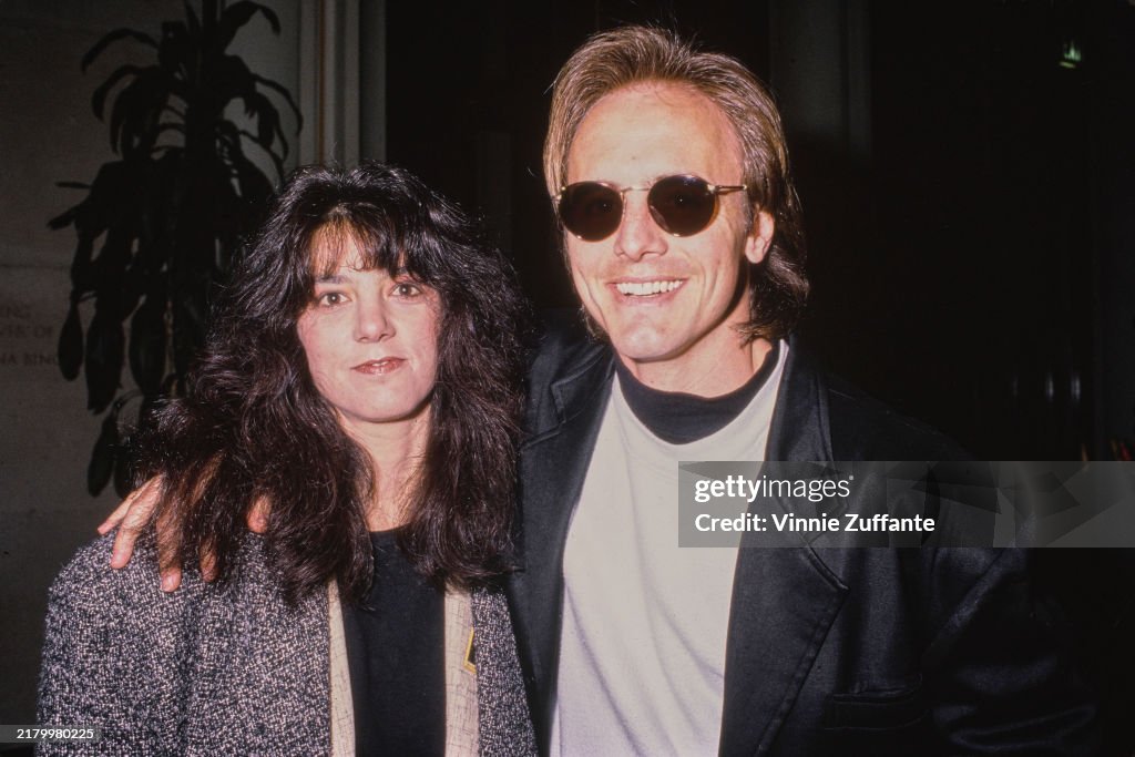 Cane Devore American actor Cain Devore, wearing a black jacket over white and ...