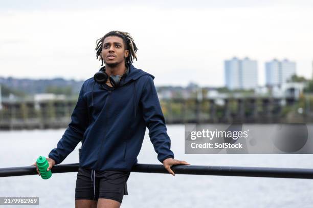 runner taking a break - self-discipline stock pictures, royalty-free photos & images