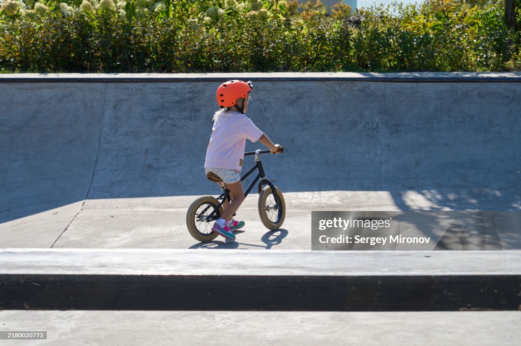 Child on Balance Bike in Skatepark