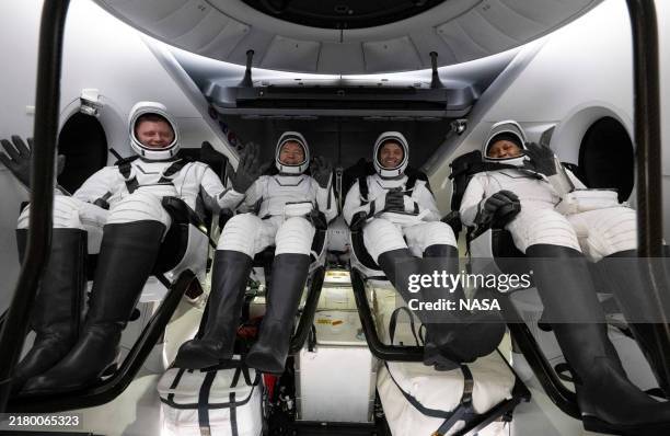In this NASA handout, Roscosmos cosmonaut Alexander Grebenkin NASA astronauts Michael Barratt Matthew Dominick and Jeanette Epps are seen inside the...