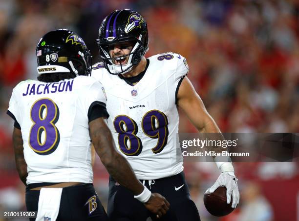 Mark Andrews of the Baltimore Ravens celebrates with Lamar Jackson after catching a pass for a touchdown during the second quarter against the Tampa...
