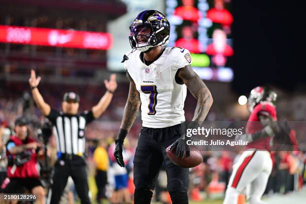 Rashod Bateman of the Baltimore Ravens celebrates after catching a 49-yard pass from Lamar Jackson for a touchdown during the third quarter against...