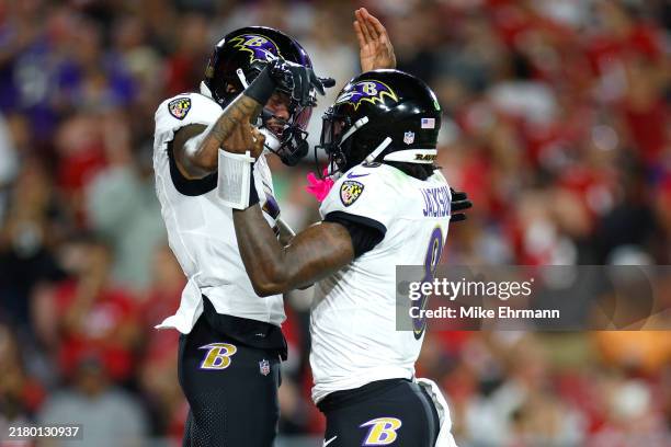 Rashod Bateman of the Baltimore Ravens celebrates his 49-yard touchdown catch with Lamar Jackson during the third quarter against the Tampa Bay...