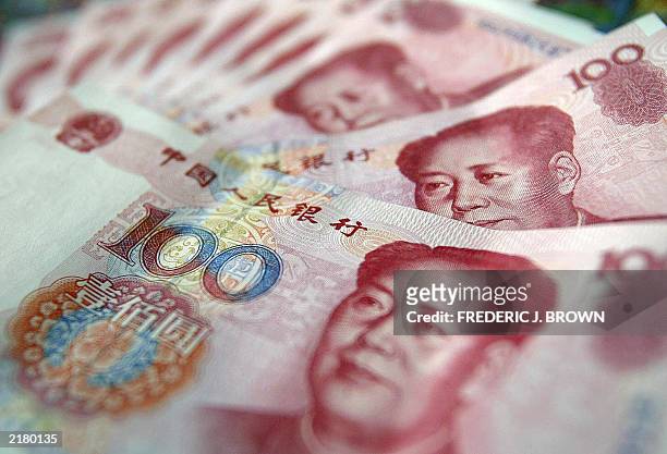 Communist China's former leader Mao Zedong is seen on 100 yuan, or renminbi , notes,18 July 2003 in Beijing. China has been accused of deliberately...