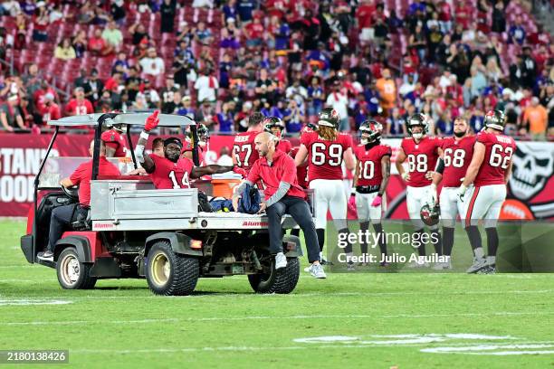 Chris Godwin of the Tampa Bay Buccaneers reacts as he is carted off the field after being injured during the fourth quarter against the Baltimore...