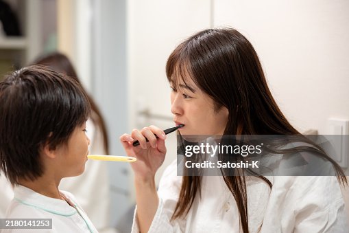 Family brushing teeth in hotel room Family brushing teeth in hotel room
