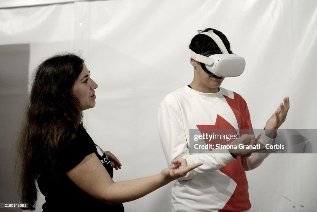 Metaverse Rome Young students try virtual reality headsets and metaverse in the ...