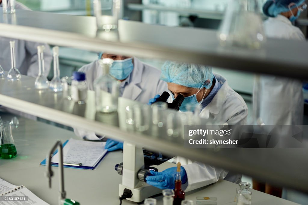 Scientists working on scientific research in laboratory.