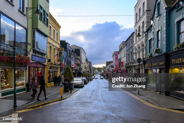 street views in killarney - stores, pubs and restaurants in downtown area - county kerry stock pictures, royalty-free photos & images