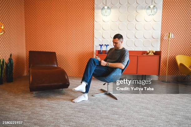 mid adult man making notes in a note pad. - leather notebook stock pictures, royalty-free photos & images