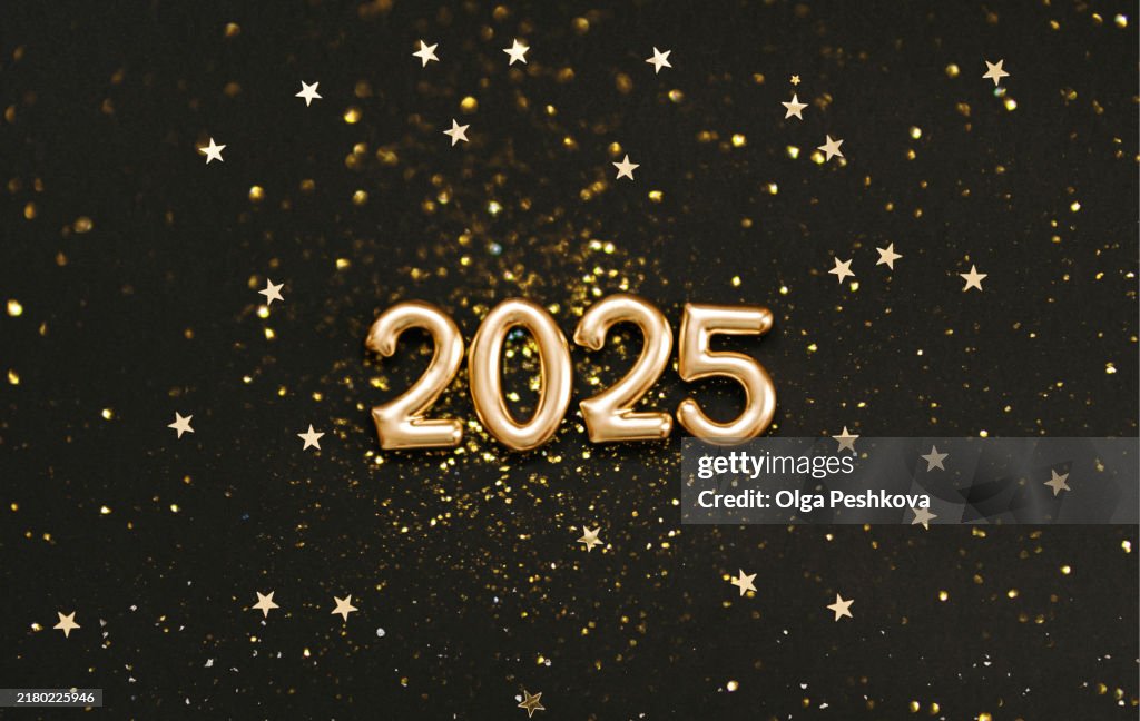 Celebratory flat lay design with golden 2025 numbers, surrounded by gold star confetti on black background