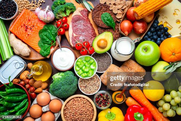 large group of raw food for a well balanced diet. includes carbohydrates, proteins and dietary fiber - salmon steak stock pictures, royalty-free photos & images