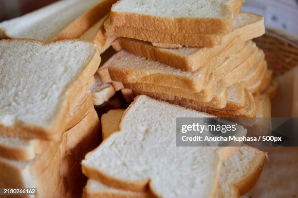 close-up of whole wheat bread slices in plate - white bread stock pictures, royalty-free photos & images