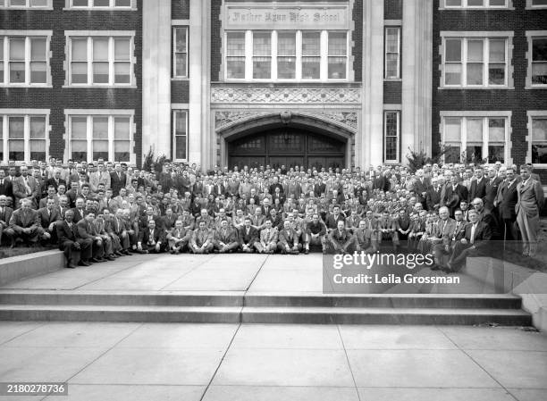 Large gathering of Knights of Columbus members take a group photo on the steps of Father Ryan High School during a retreat, circa 1960 in Nashville,...