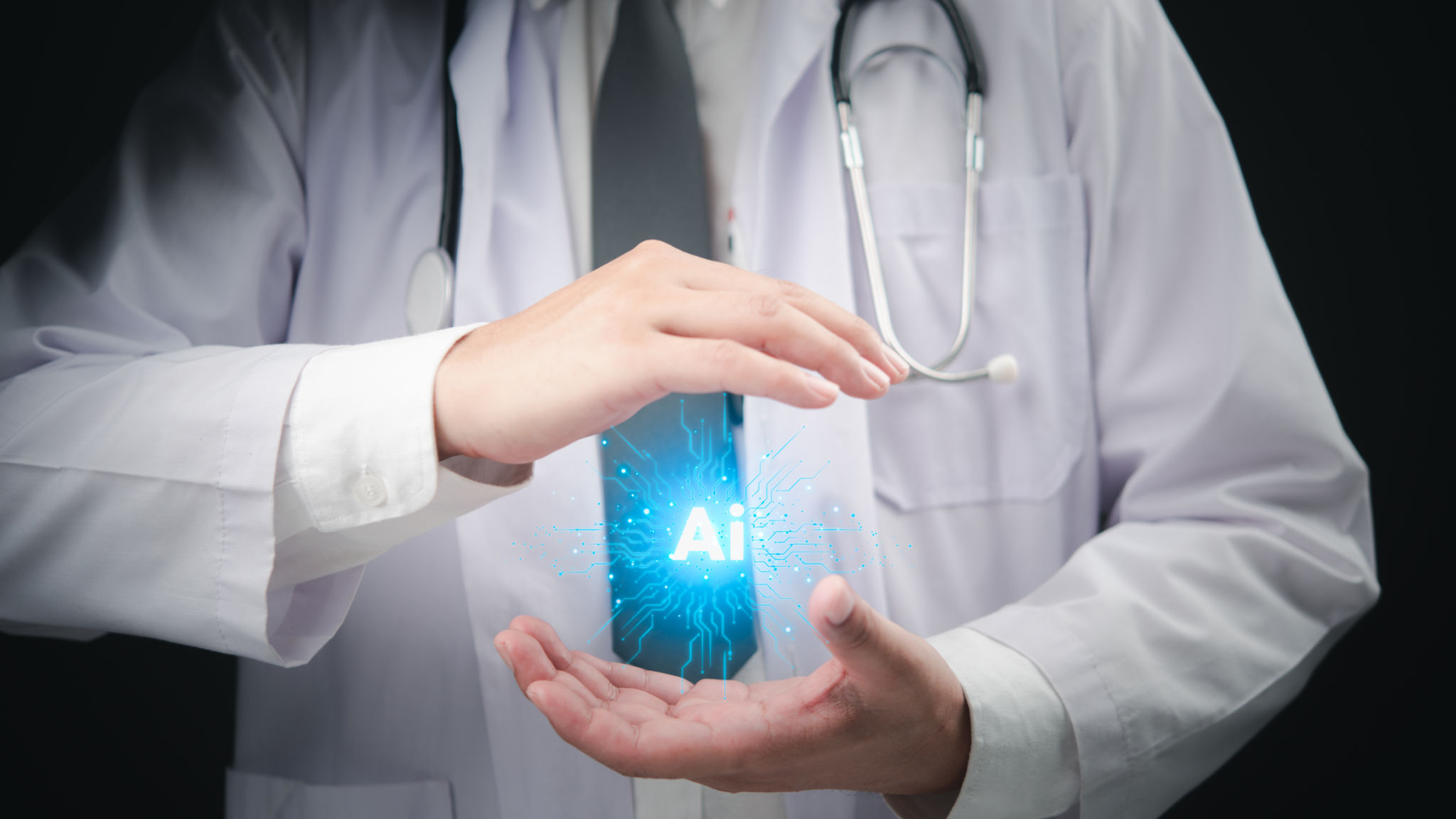 Doctor hands surrounding a glowing AI icon, symbolizing artificial intelligence in healthcare. Doctor hands surrounding a glowing AI icon, symbolizing artificial intelligence in healthcare.