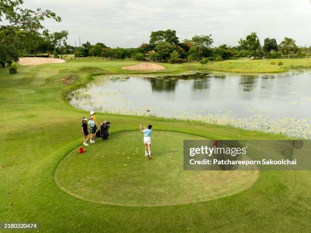 golfer - mature asian golf stock pictures, royalty-free photos & images