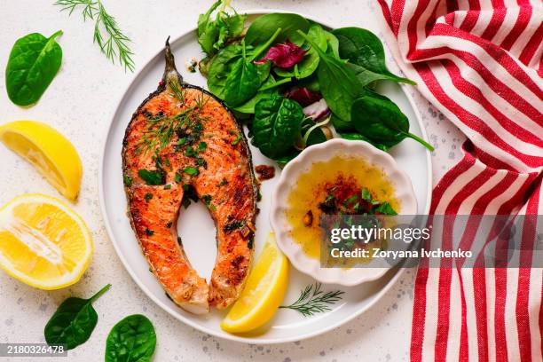 baked salmon with baked salmon with vegetables vegetables - salmon steak stock pictures, royalty-free photos & images