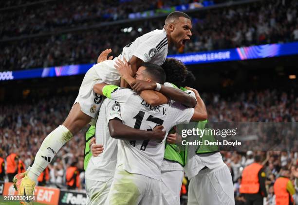 Lucas Vazquez of Real Madrid celebrates with teammates after scoring his team's third goal during the UEFA Champions League 2024/25 League Phase MD3...